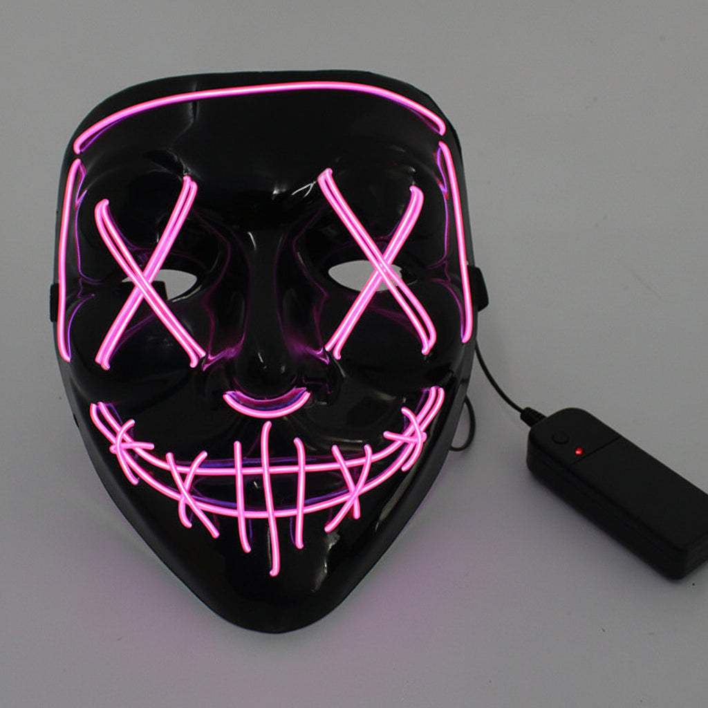 Black mask with pink LED lights and a power adapter on a gray background.