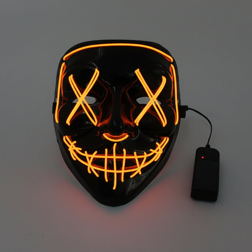 Black mask with orange LED lights and a power bank on a gray background