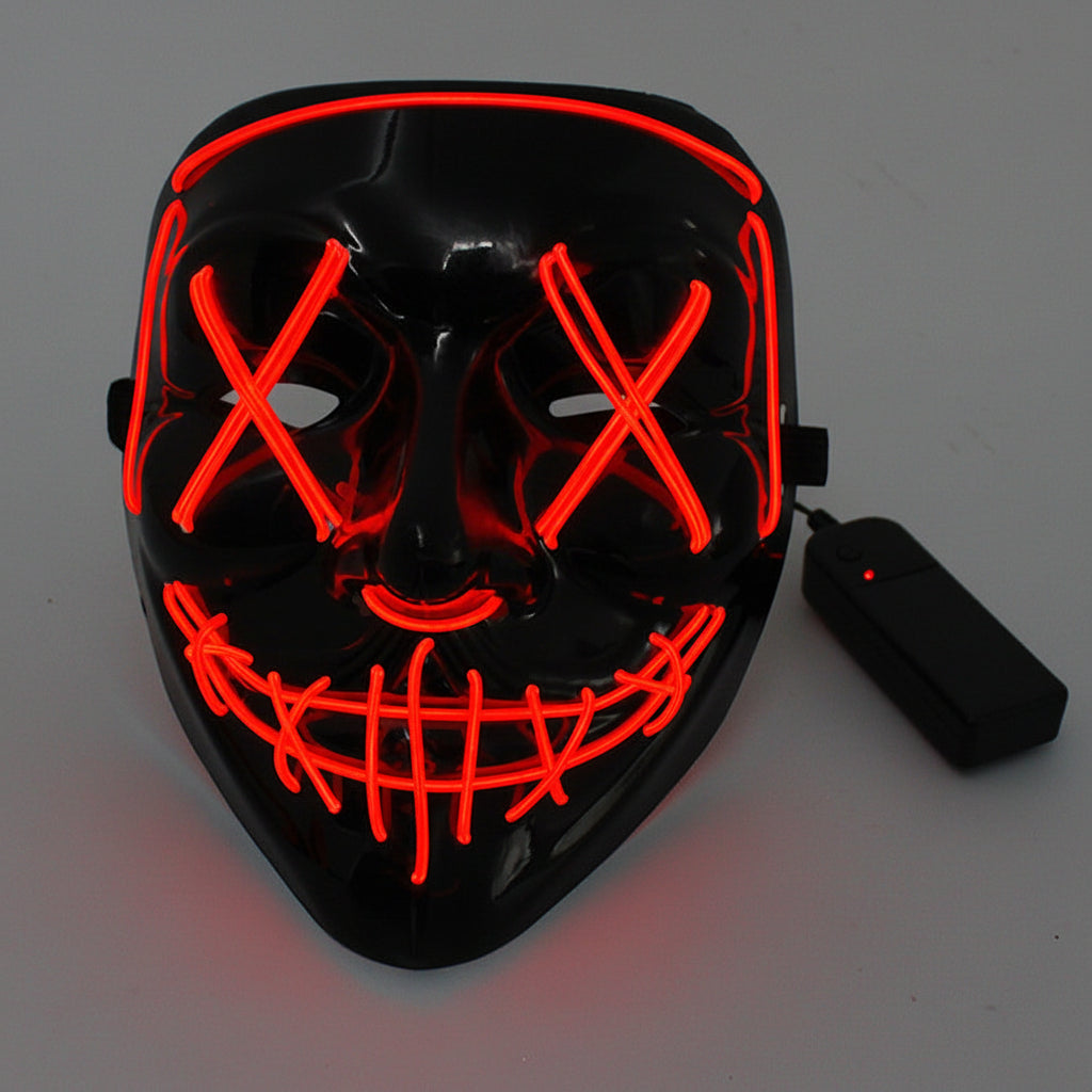 Black mask with red LED lights and a remote control on a gray background.