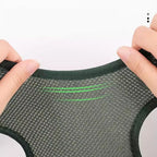 Textured green and gray fabric with green stitching, held by hands against a white background.